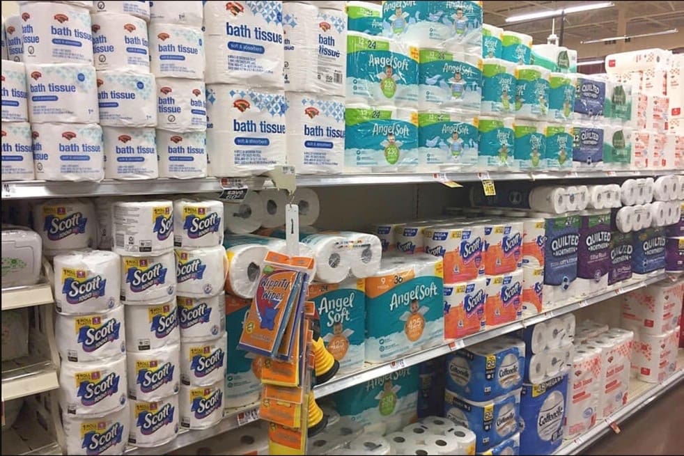 image description: store shelves stacked full of toilet paper