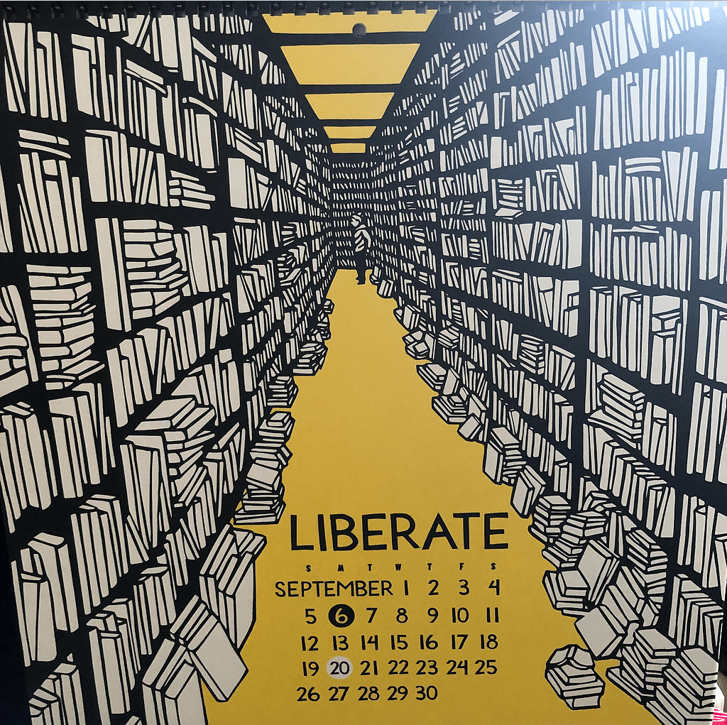 September from Nikki McClure's 2021 calendar. Image description: black and white image of books stacked floor to ceiling against yellow backdrop with a person in the distant center gazing at them, standing on yellow ground.